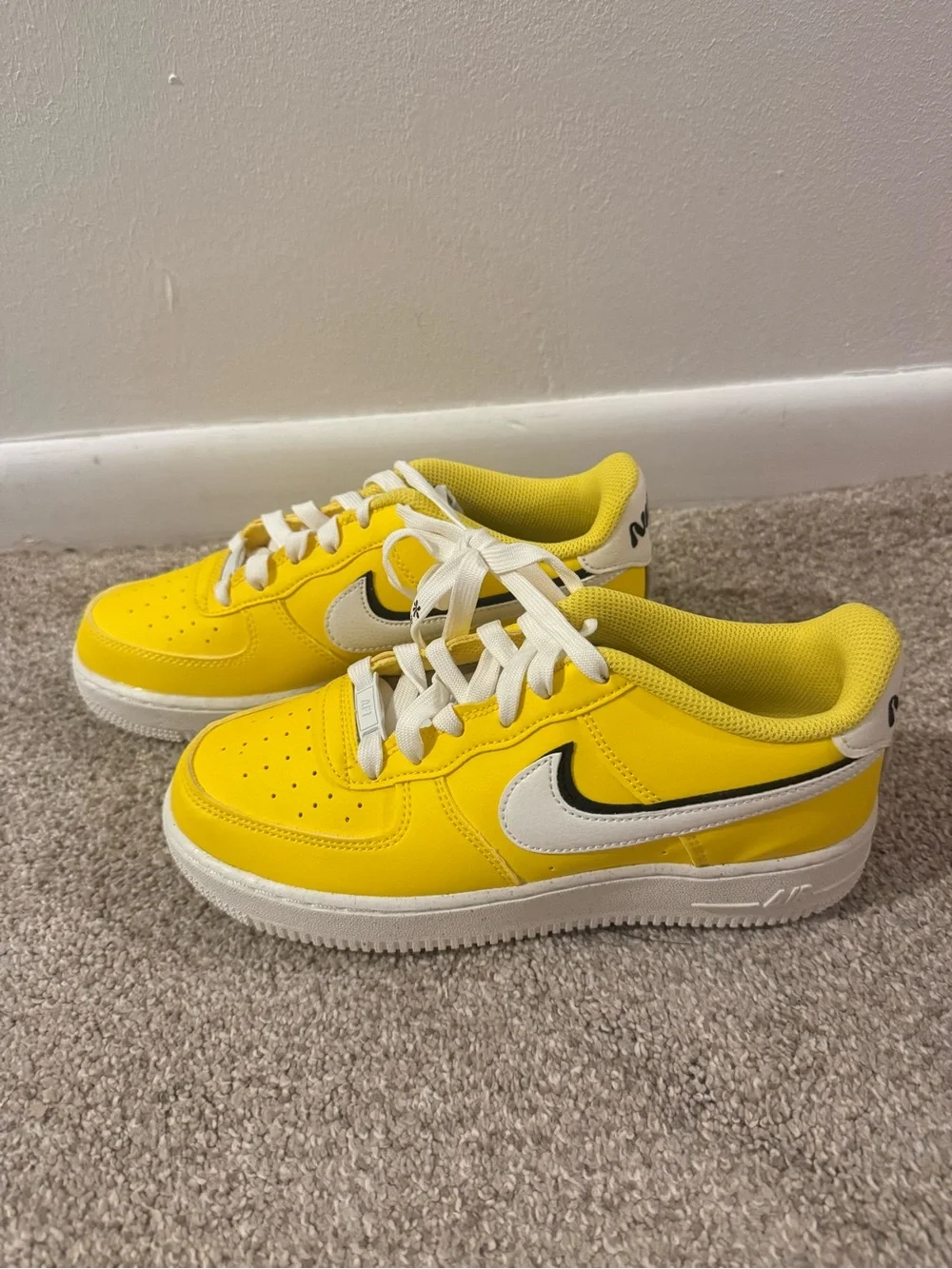 Nike Yellow & White Low-Top Sneakers with Black Swoosh Outline